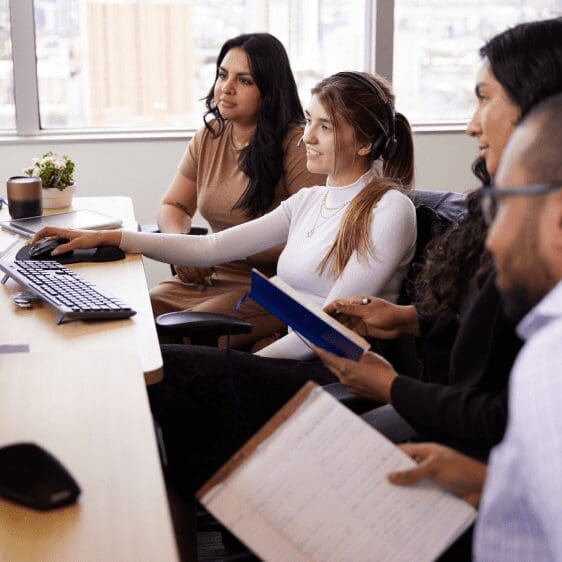 Friendly support specialists assisting policyholders